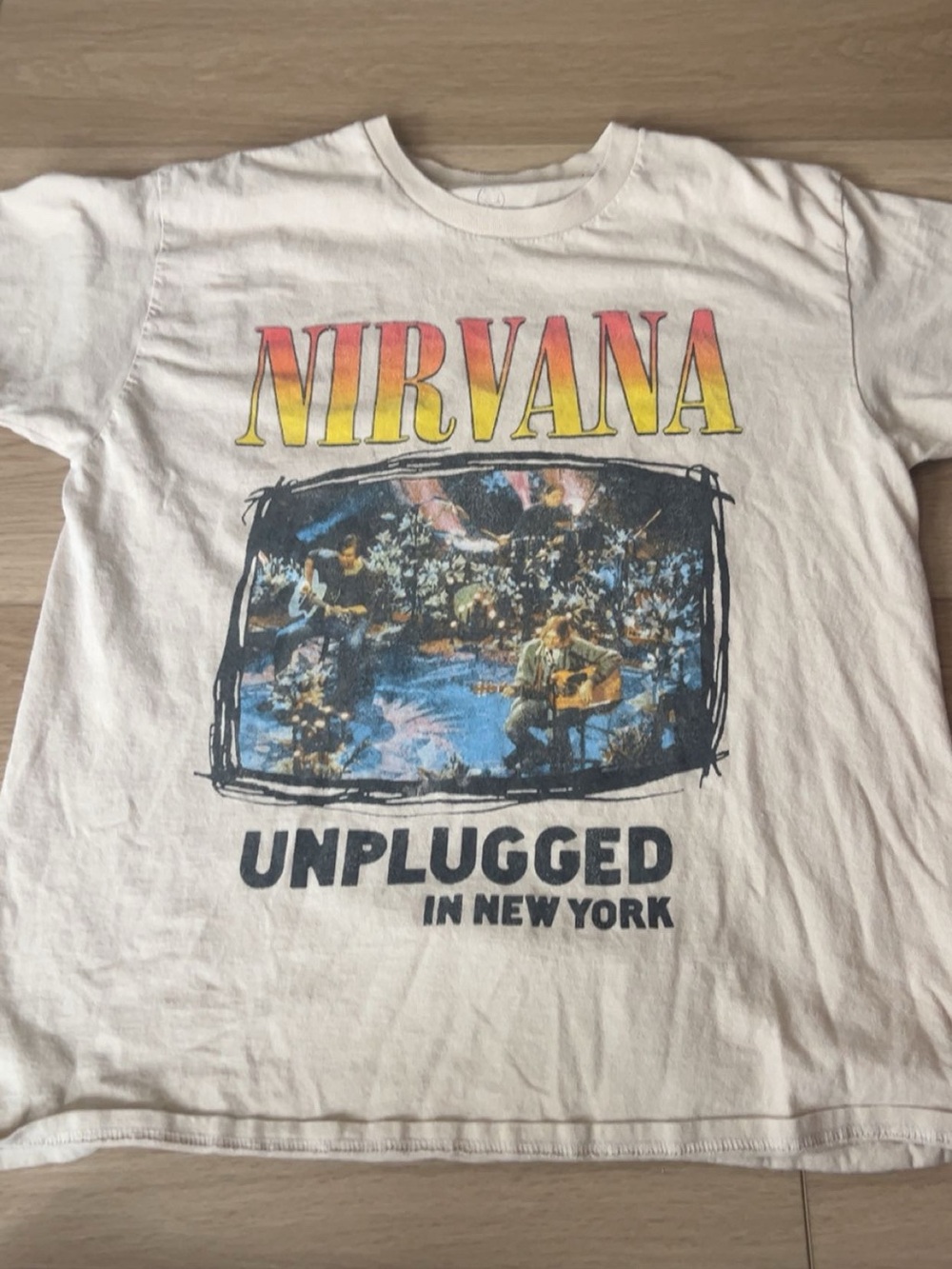 NIRVANA White 'Unplugged in New York' Graphic Tee with Yellow-Orange Logo